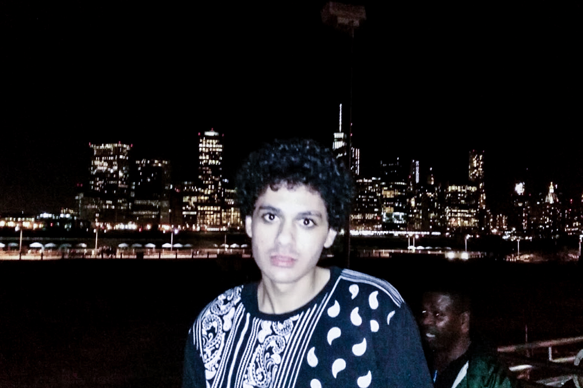 Abdulrahman El Bahnasawy poses in front of the New York City skyline.