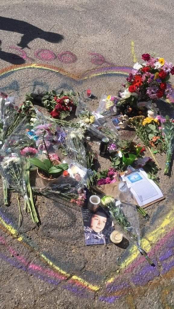 A memorial for Athan McEwen in a parking lot on Sunset Drive where the 15-year-old was fatally struck by a vehicle.