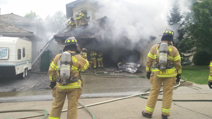 Fire crews could be seen fighting a fire at a garage on Blackburn Drive in southwest Edmonton on Friday night.