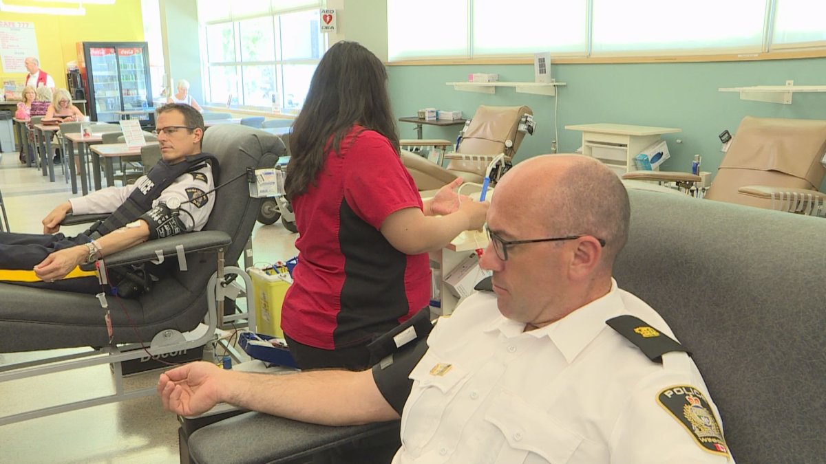 Insp. Nick Paulet of the Winnipeg Police Service rolls up his sleeve and gives blood. Him and many other local emergency workers will be giving blood as part of the Sirens For Life campaign.