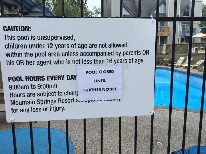A sign is posted at a Blue Mountain resort pool on June 27, 2018.