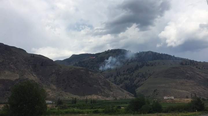 Smoke rises from a fire near Cawston, B.C., on Thursday afternoon.