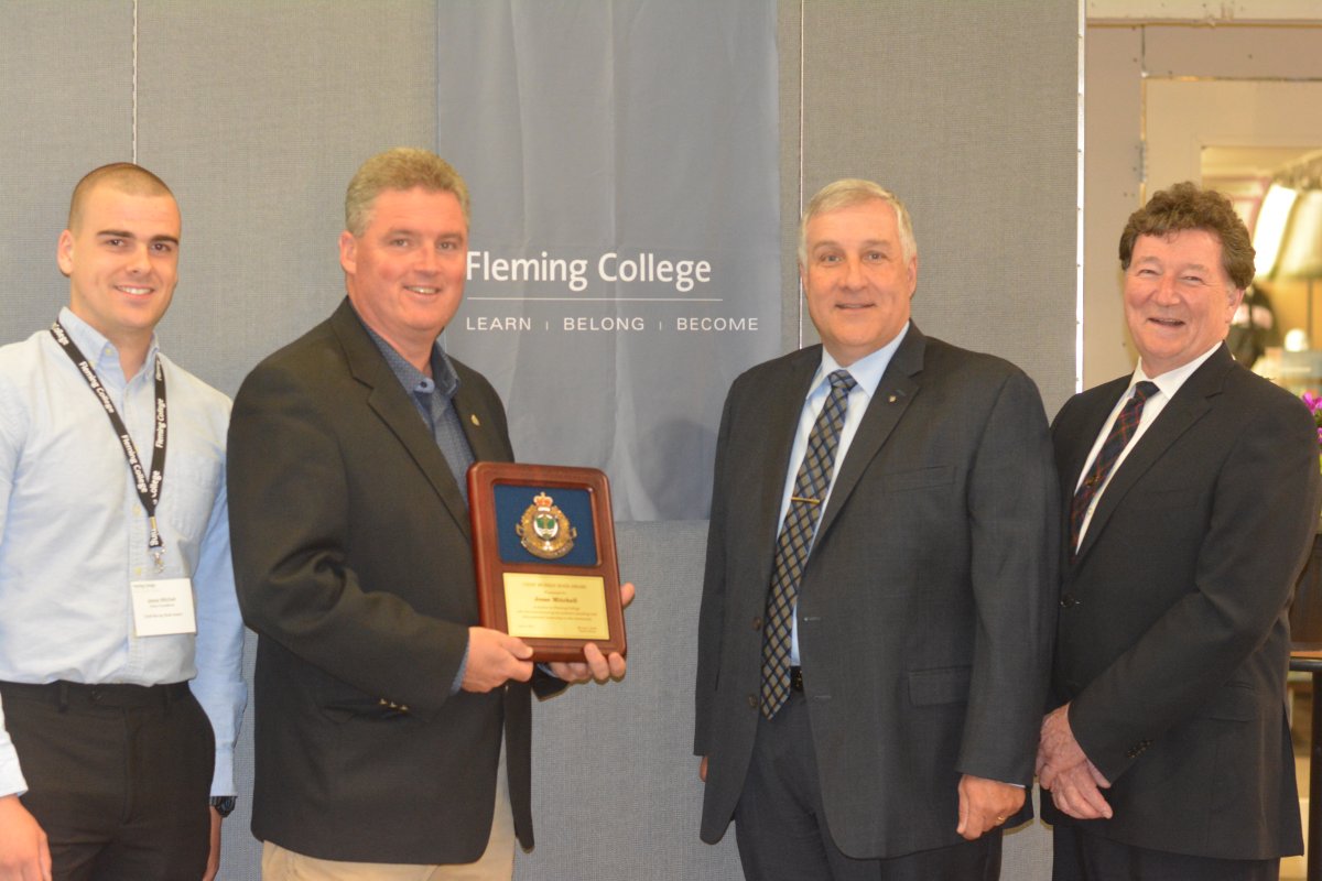 Fleming College in Peterborough announced the Chief Murray Rodd Award to recognizing the retiring police chief. Taking part in the presentation were, from left, award recipient Jesse Mitchell, Police Services Board chairman Bob Hall, chief Murray Rodd and Fleming president Tony Tilly. 