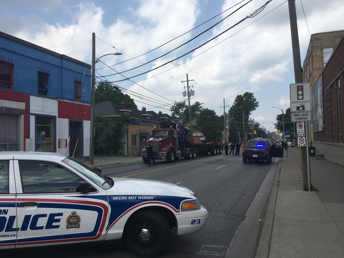 London police say a cyclist is dead after a crash with a flatbed truck shortly after 12 p.m. Wednesday.