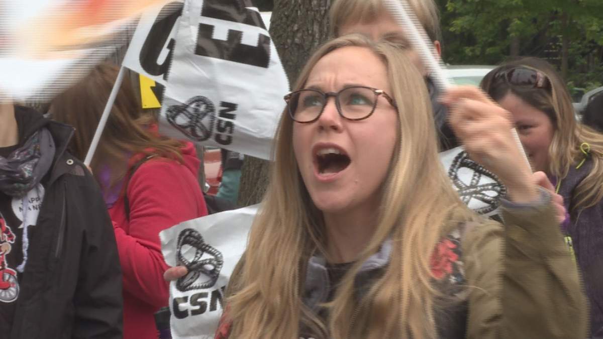 Workers picket outside a daycare in Villeray as part of an unlimited strike by daycare workers in Montreal and Laval. (Global News)