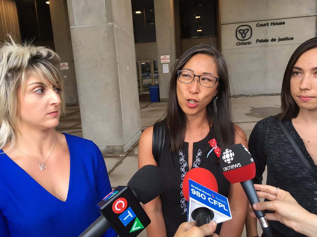 Ashley Charters (left), a friend of Nathan Deslippe and a former partner of William Joles, stands outside the courthouse next to Nathan's mom and sister, Mona Lam-Deslippe (centre), and Jessica Deslippe (right).