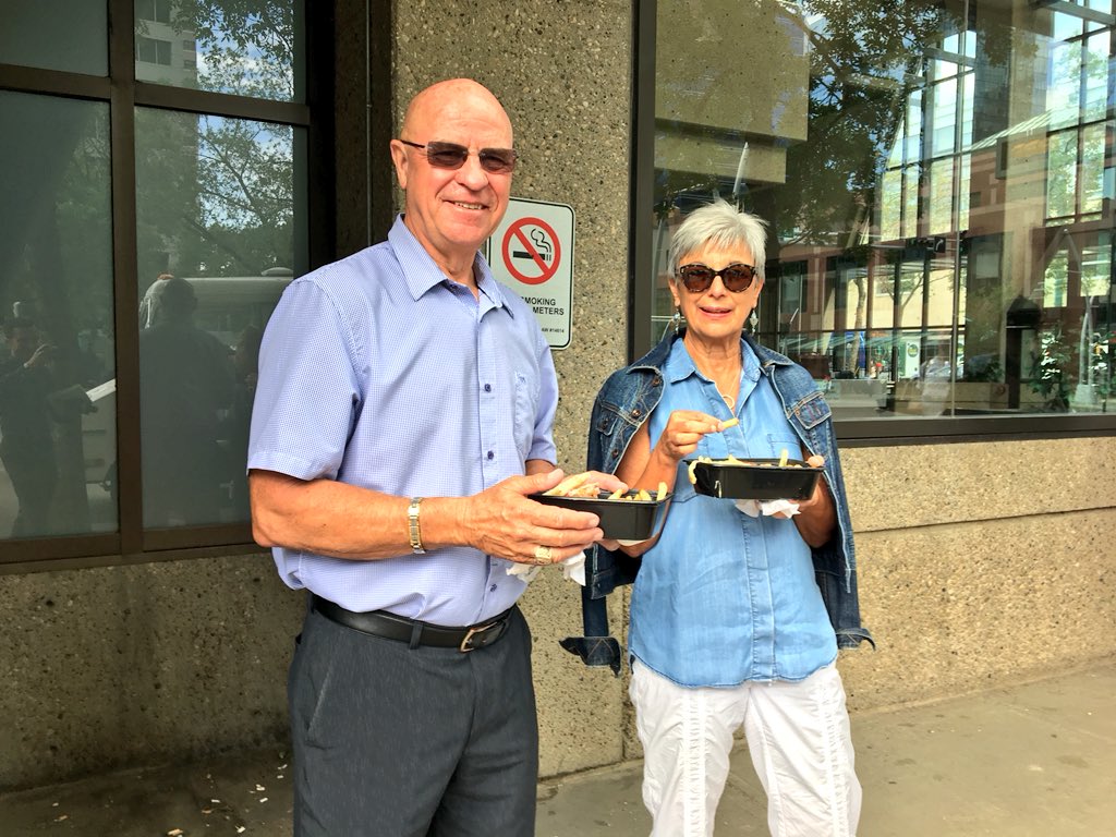 Customers with their purchase from the Boyle Street Eats food truck on June 29, 2018.