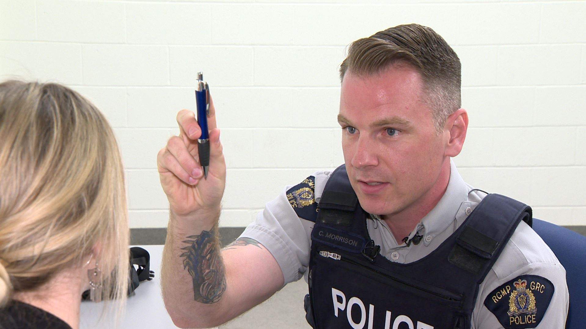 RCMP Const. Chad Morrison performs a test on Alex Noonan, a junior communications officer for the police, as part of a staged drug recognition evaluation for journalists in Dartmouth, N.S., on June 29, 2018.