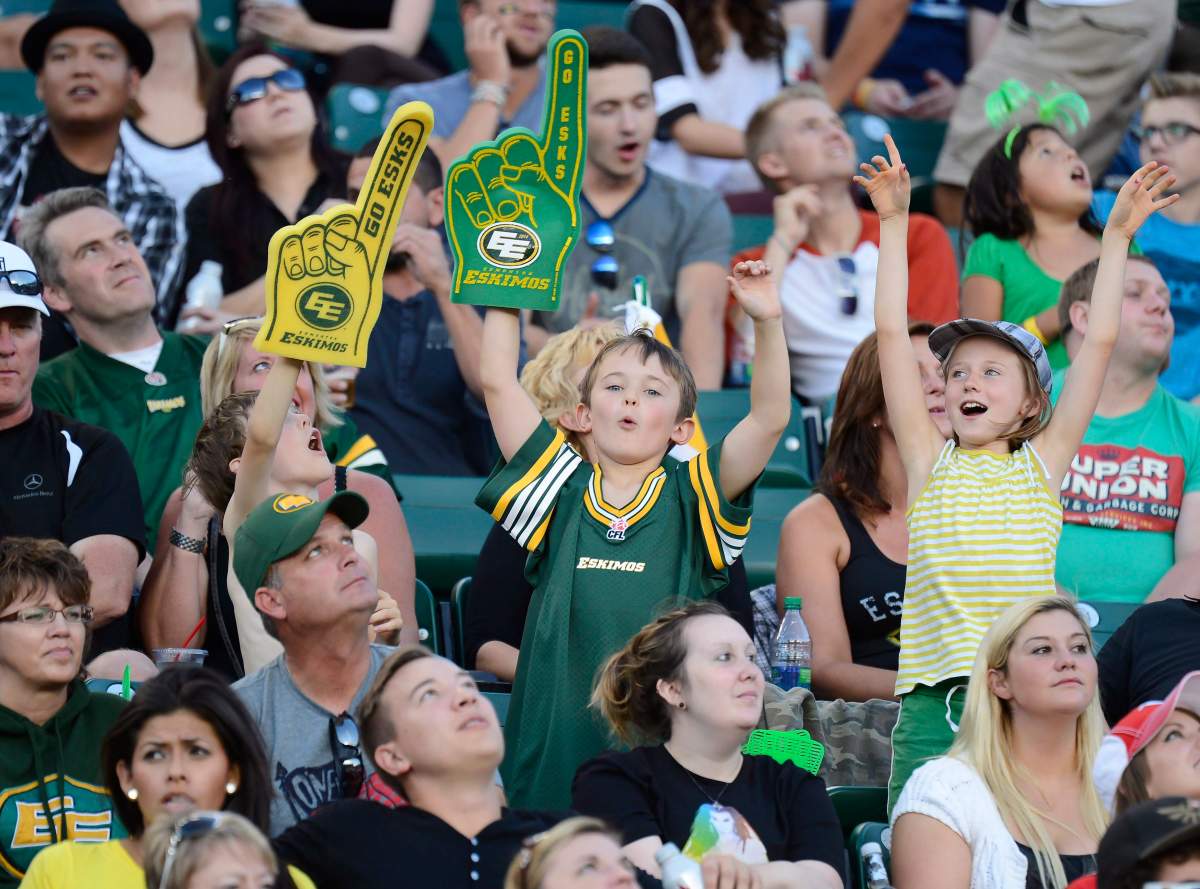 Edmonton Eskimos fans cheer on their team during second half CFL football action against the Calgary Stampeders in Edmonton on Saturday, Sept. 6, 2014. 