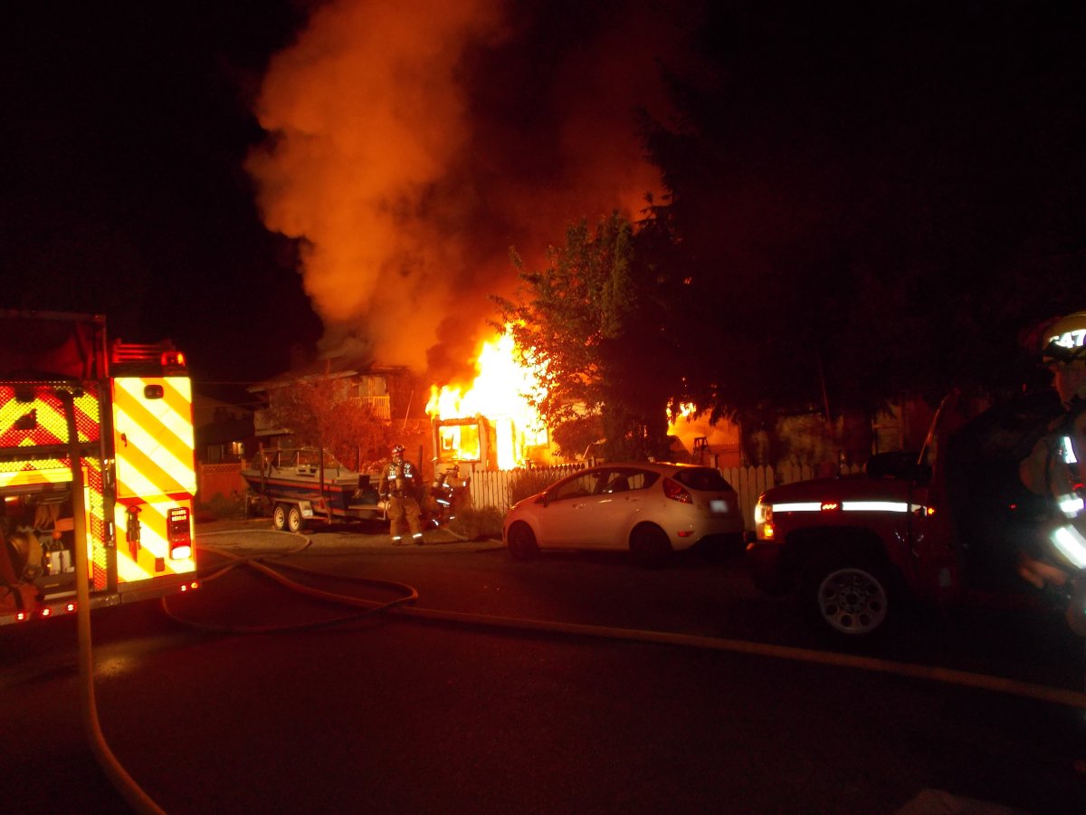 One person is in hospital with serious injuries after an overnight house fire in Squamish.