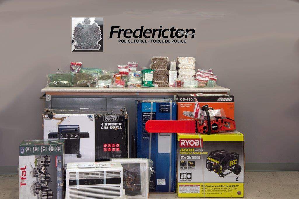 A photo of what the Fredericton Police Force allege are drugs, illegal tobacco and stolen property they seized in a raid on June 1, 2018. 