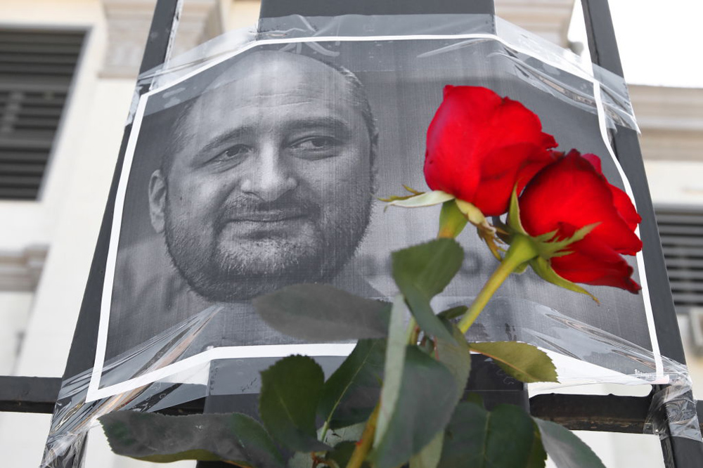 Flowers and a portrait of journalist Arkady Babchenko are displayed near the Russian Embassy in Kiev. Reports of Babchenko's death were circulated as part of a deception. 
