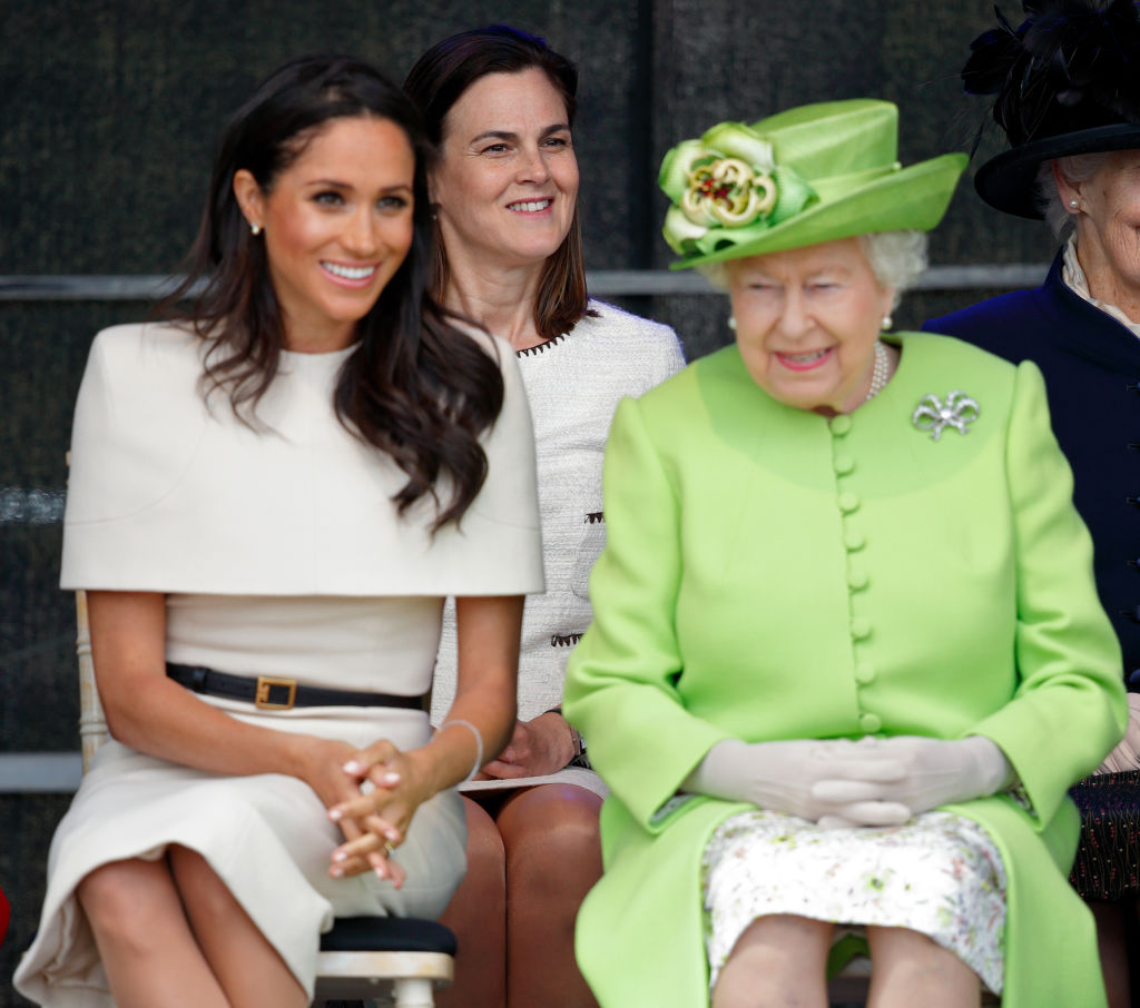 Meghan, Duchess of Sussex and Queen Elizabeth II (accompanied by Samantha Cohen) attend a ceremony to open the new Mersey Gateway Bridge on June 14. Photo by Getty Images