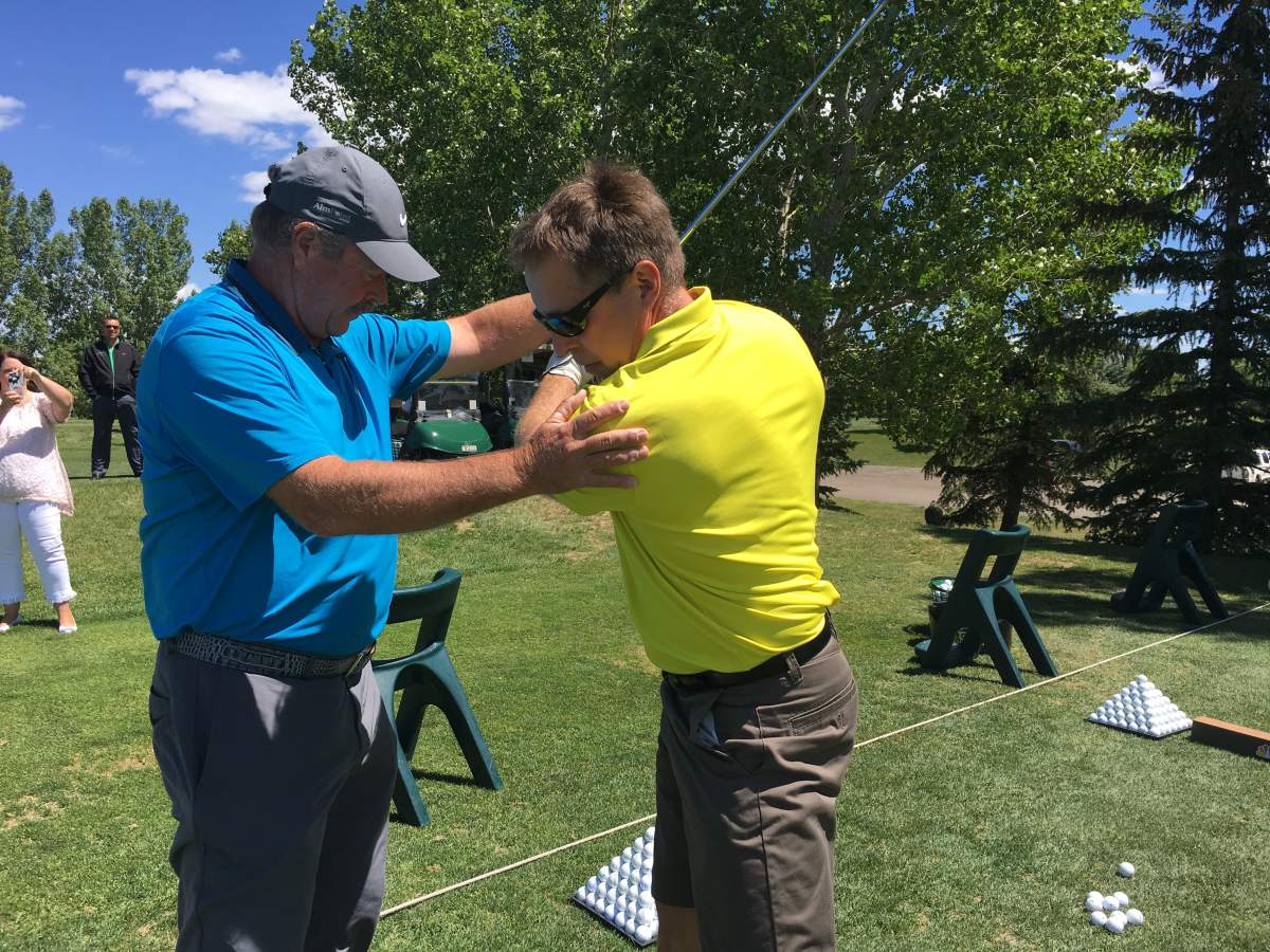 Paul Horton gives golf instruction at Heritage Pointe Golf Club in De Winton, Alta. June 12, 2018.