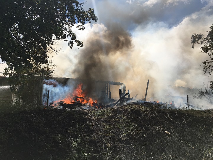 Fire ravaged two houses on Wednesday in Grand Forks. Though the houses were destroyed, all occupants made it out safely.