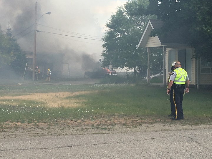 Smoke was thick near the two houses in Grand Forks, B.C., that were destroyed by fire on Wednesday.