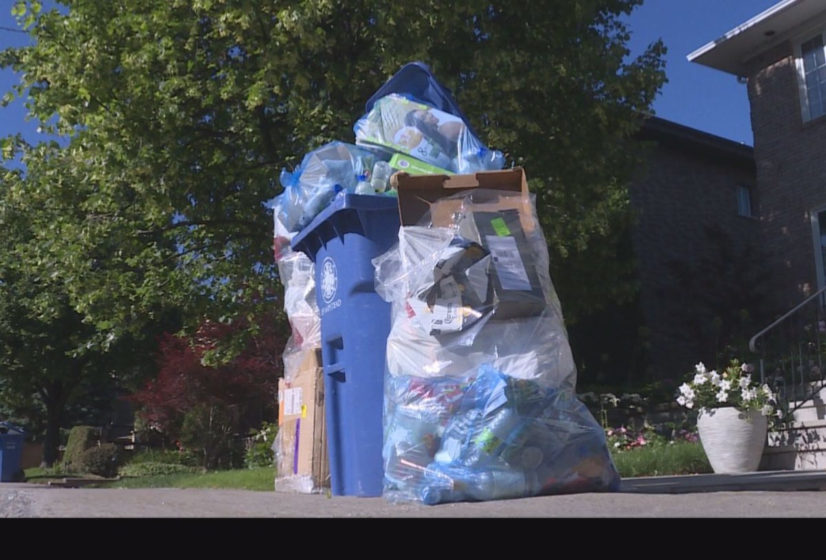 A pile of trash for recycling sits outside a house in Hampstead, one week after pickup service was interrupted because of problems at a recycling plant.