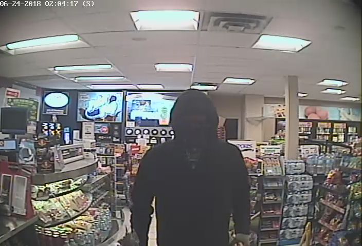 OPP are seeking the public's assistance in identifying a suspect (above) accused of robbing a gas station in Huntsville.