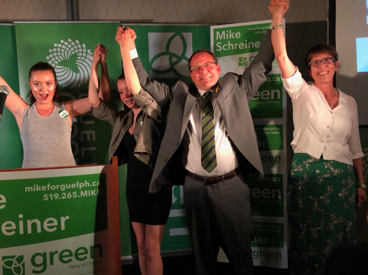 Green Party Leader Mike Schreiner celebrates his election victory with his family in Guelph on Thursday night.