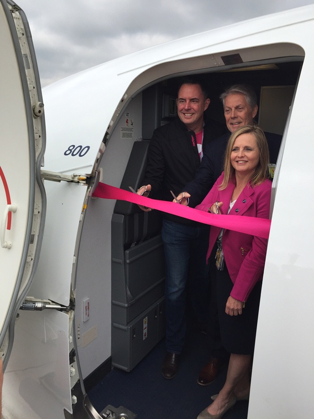 Swoop president and CEO Steven Greenway, Hamilton Mayor Fred Eisenberger and Hamilton International Airport president and CEO Cathie Puckering cut the ribbon on Swoop’s first plane ahead of its inaugural flight out of Hamilton.