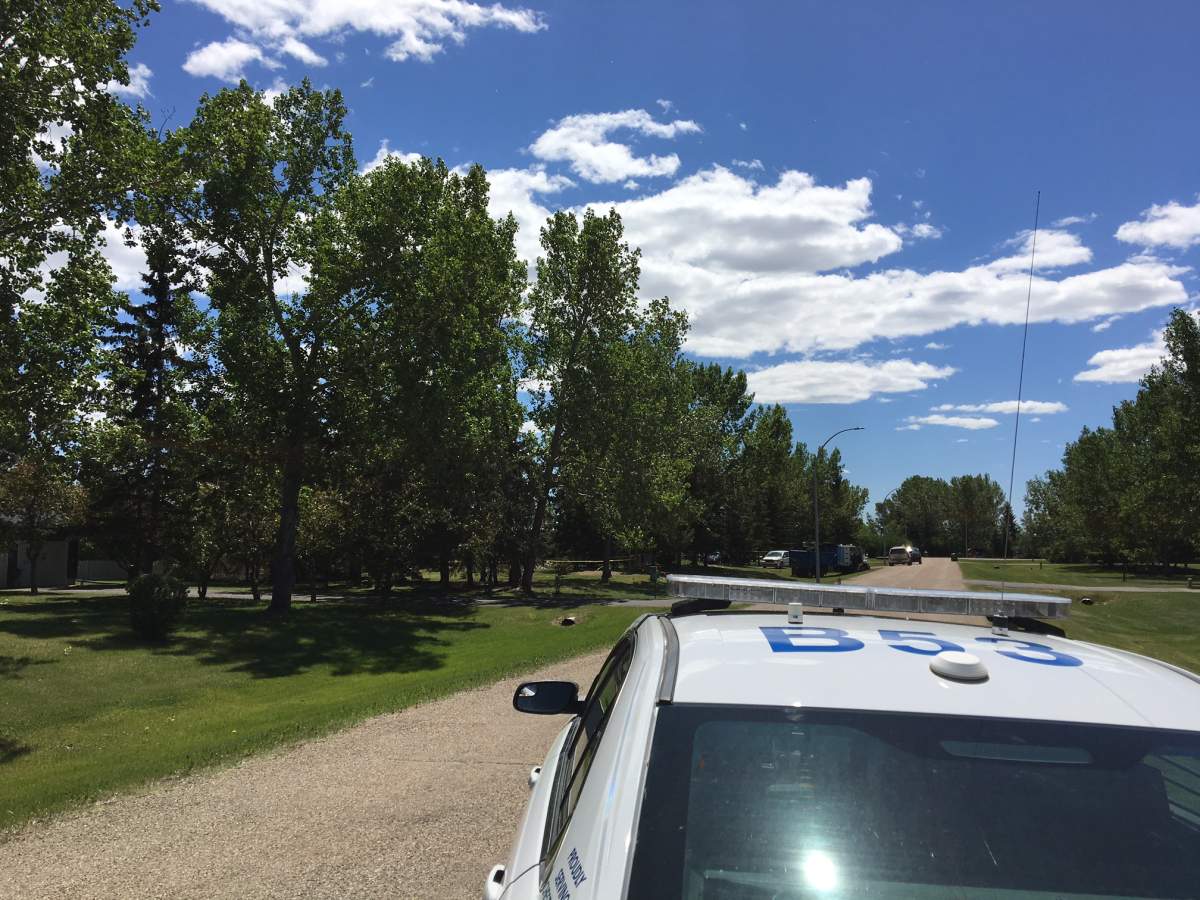 RCMP at the scene of a fire in Chestermere on Tuesday, June 12.