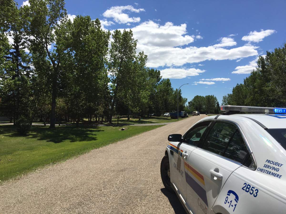 RCMP at the scene of a fire in Chestermere on Tuesday, June 12.
