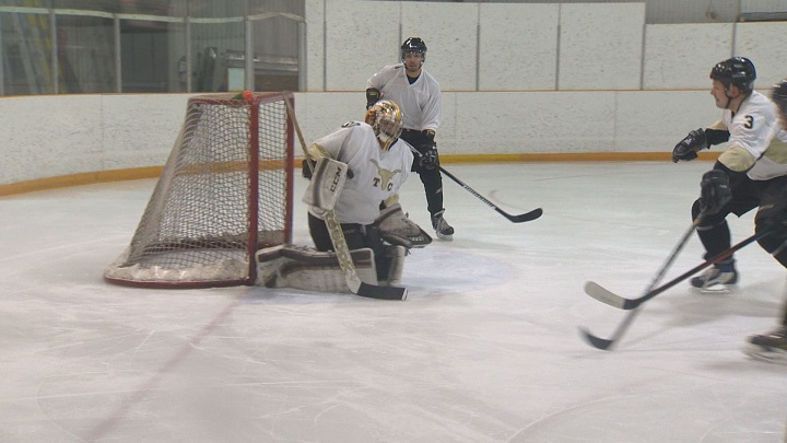 Winnipeg Jets emergency goalie Joe Caligiuri makes a save in the local lawyers league at the Winnipeg Winter Club.