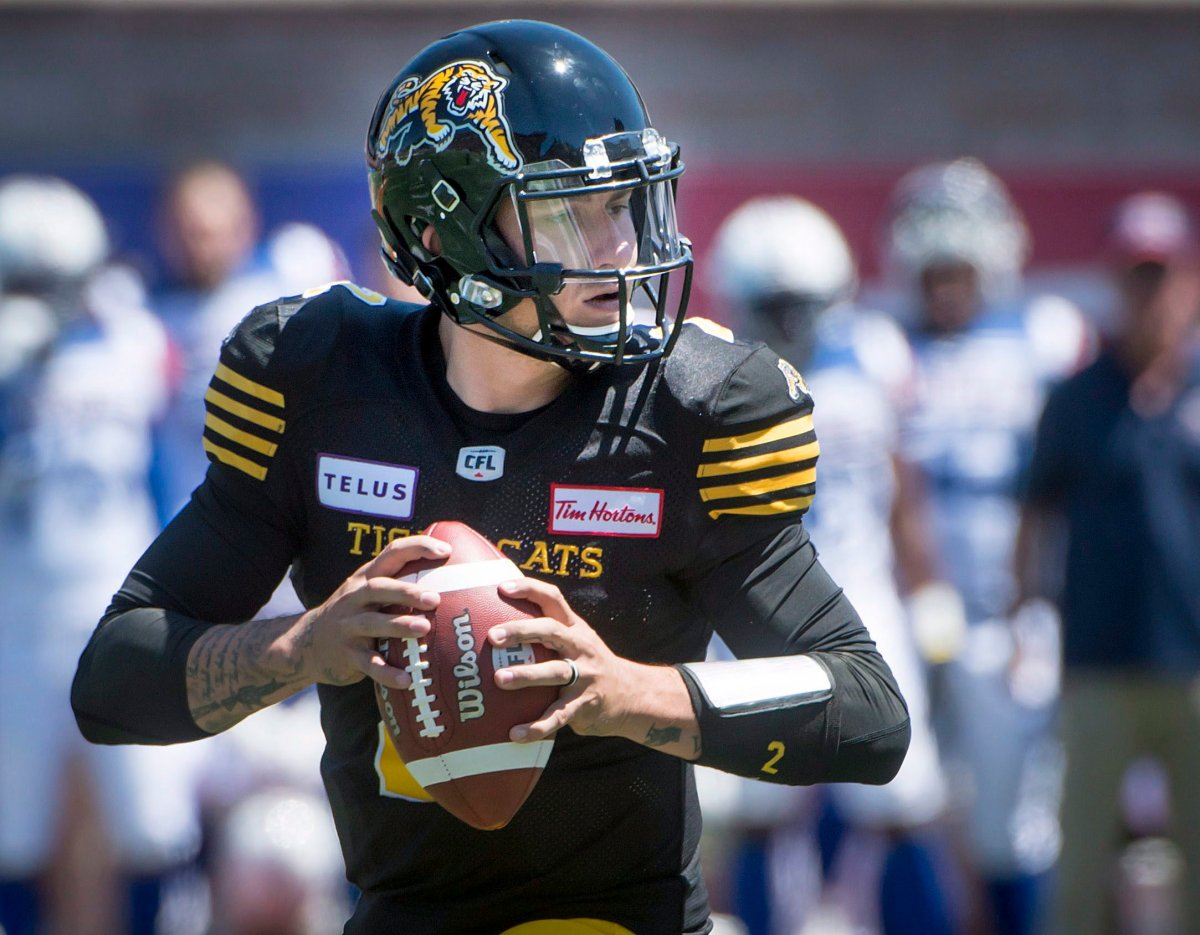 Hamilton Tiger-Cats quarterback Johnny Manziel throws the ball during first half pre-season CFL football action against the Montreal Alouettes in Montreal on Saturday, June 9, 2018.