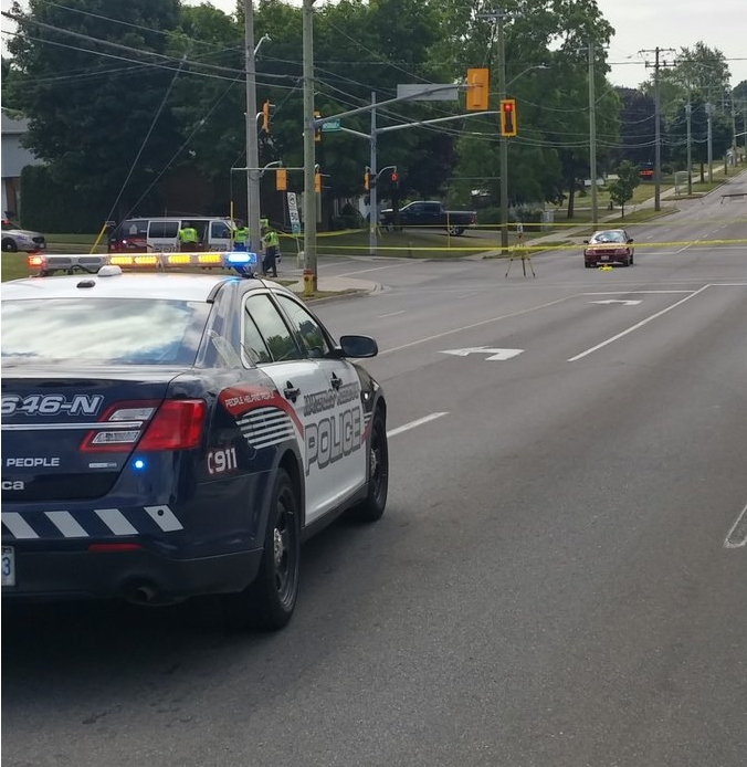 Police block off the scene in Kitchener where a crossing guard was struck by a car on Thursday morning.