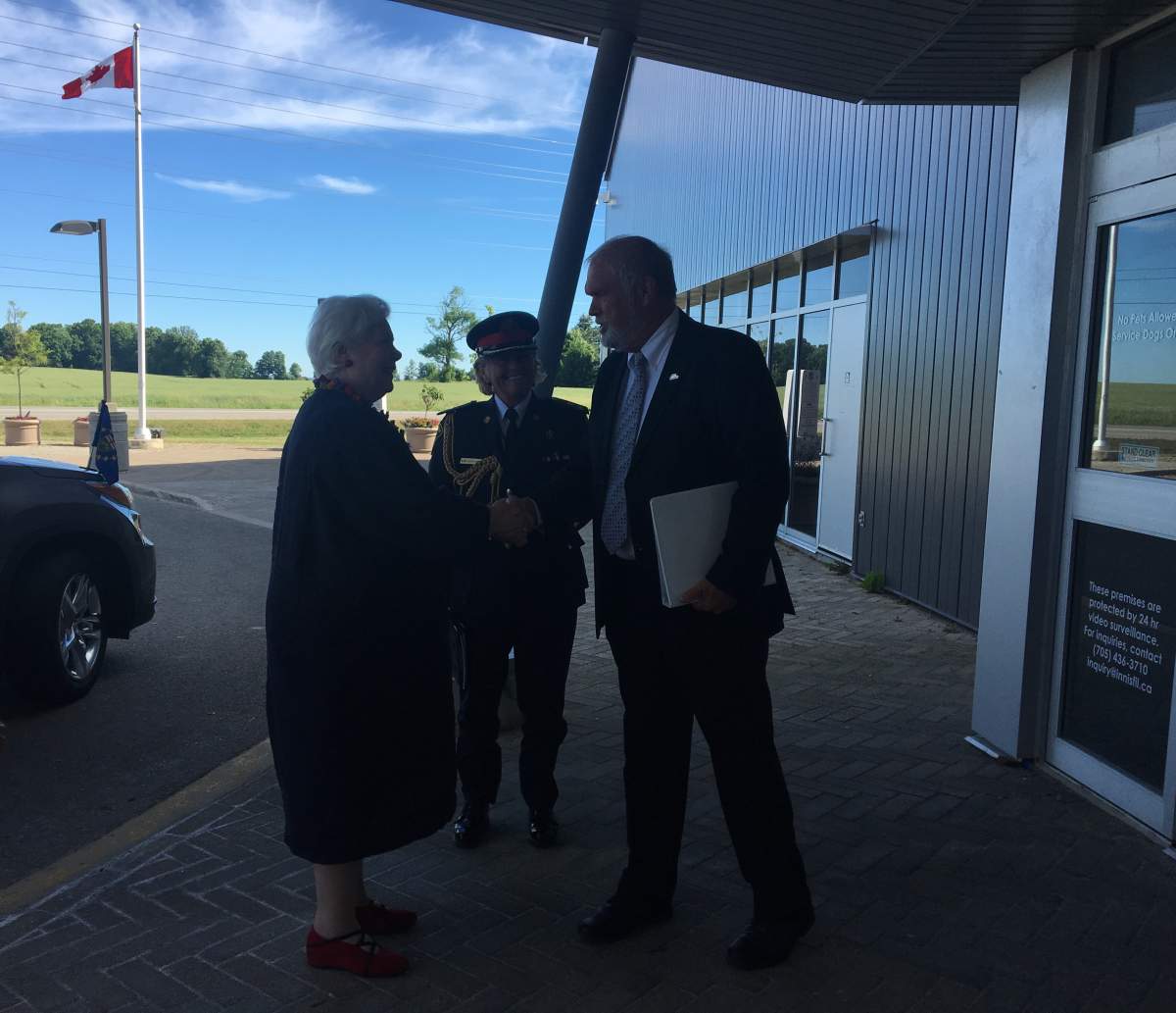 Innisfil Mayor Gord Wauchope greets Lt.-Gov. Elizabeth Dowdeswell outside of Innisfil Town Hall.