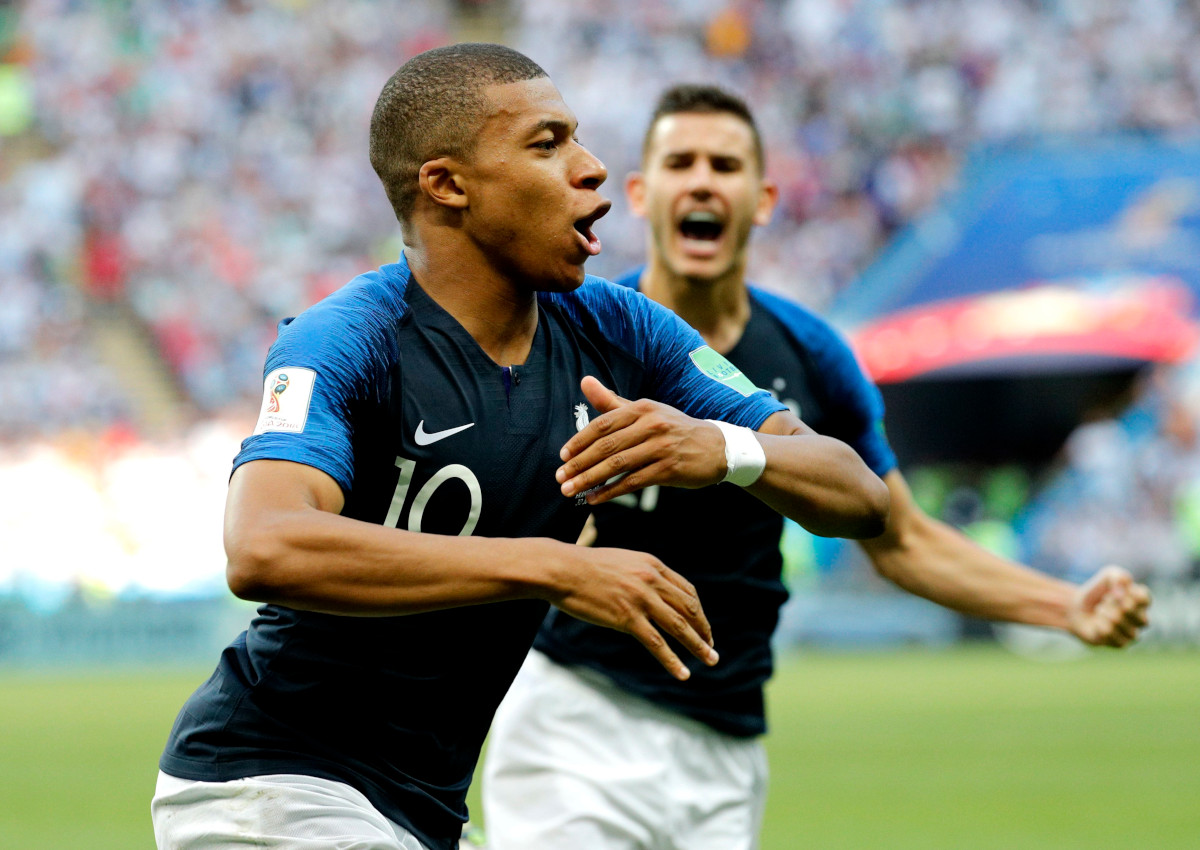 Kylian Mbappe of France celebrates scoring the 3-2 goal during the FIFA World Cup 2018 round of 16 soccer match between France and Argentina in Kazan, Russia, 30 June 2018.

(RESTRICTIONS APPLY: Editorial Use Only, not used in association with any commercial entity - Images must not be used in any form of alert service or push service of any kind including via mobile alert services, downloads to mobile devices or MMS messaging - Images must appear as still images and must not emulate match action video footage - No alteration is made to, and no text or image is superimposed over, any published image which: (a) intentionally obscures or removes a sponsor identification image; or (b) adds or overlays the commercial identification of any third party which is not officially associated with the FIFA World Cup)  EPA/SERGEY DOLZHENKO EDITORIAL USE ONLY  EDITORIAL USE ONLY.