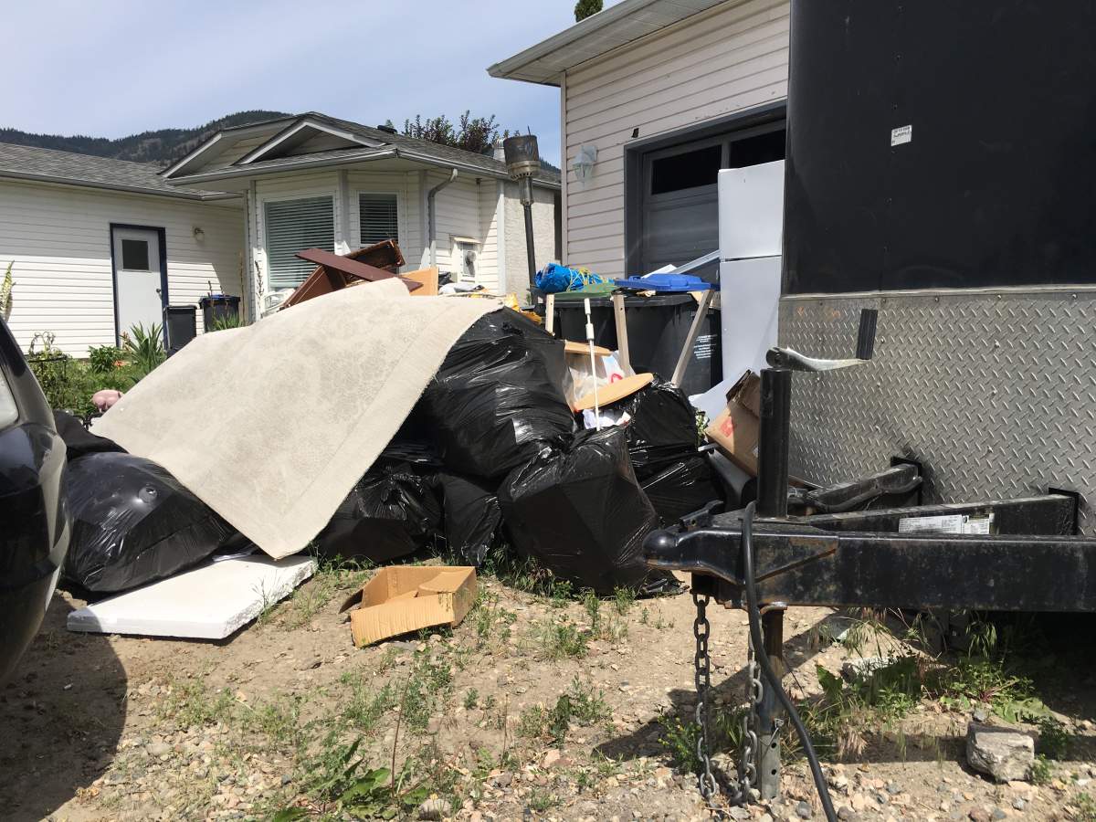 Residents in West Kelowna neighborhood elated neighbour’s unsightly yard finally getting cleaned up - image