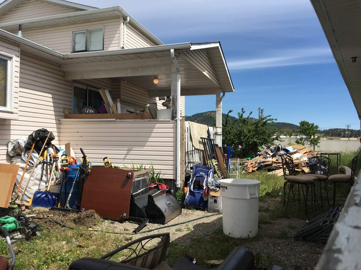 Residents in West Kelowna neighborhood elated neighbour’s unsightly yard finally getting cleaned up - image