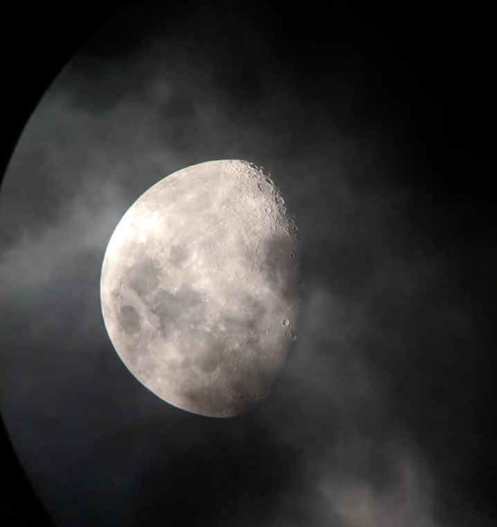 A picture of the moon taken through a telescope.