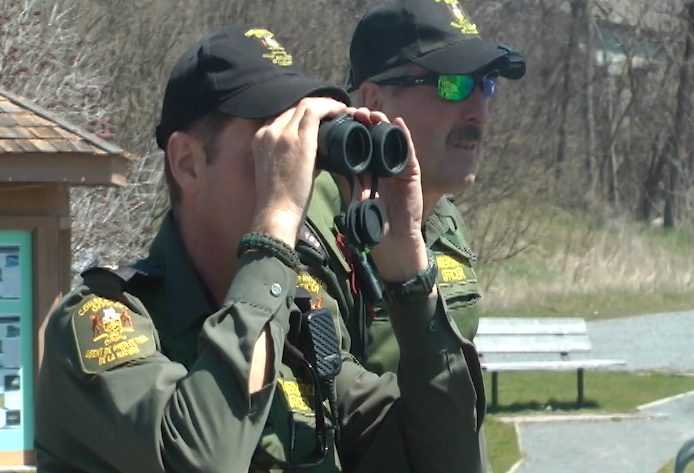 Conservation officers with the Ministry of Natural Resources and Forestry patrol the Ganaraska River.