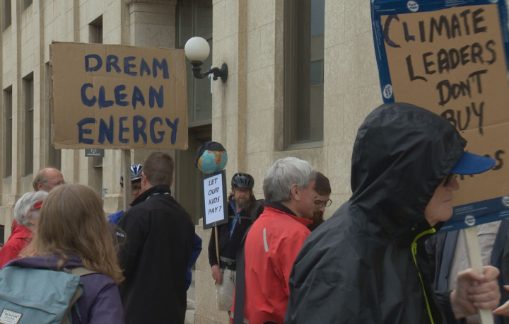 The group protested the Kinder Morgan bailout outside a federal building in downtown Saskatoon.