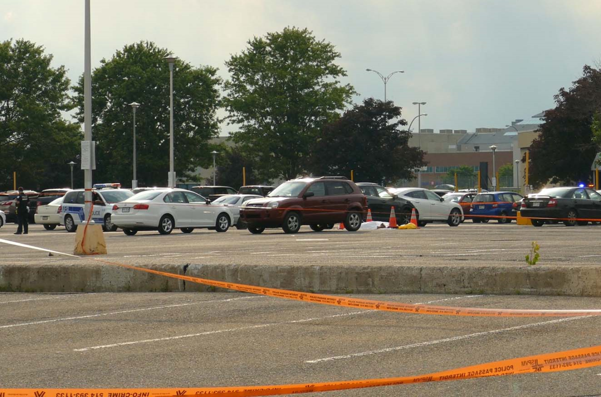Montreal police are investigating after the body of a man was discovered in a hotel parking lot in Pointe-Claire. Saturday, June 30, 2018.