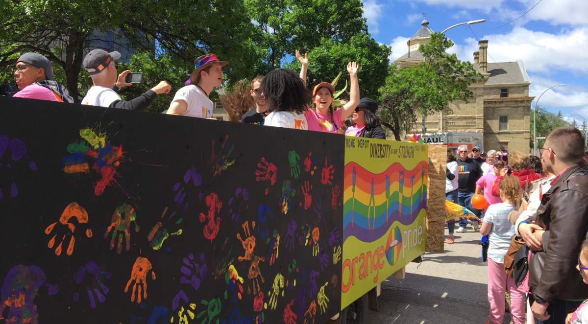 Participants celebrate in one of the several floats on the streets Sunday.