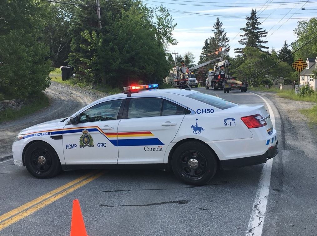 Police block off a section of road following a single-vehicle crash along Lawrencetown Road on Thursday, 21, 2018. 