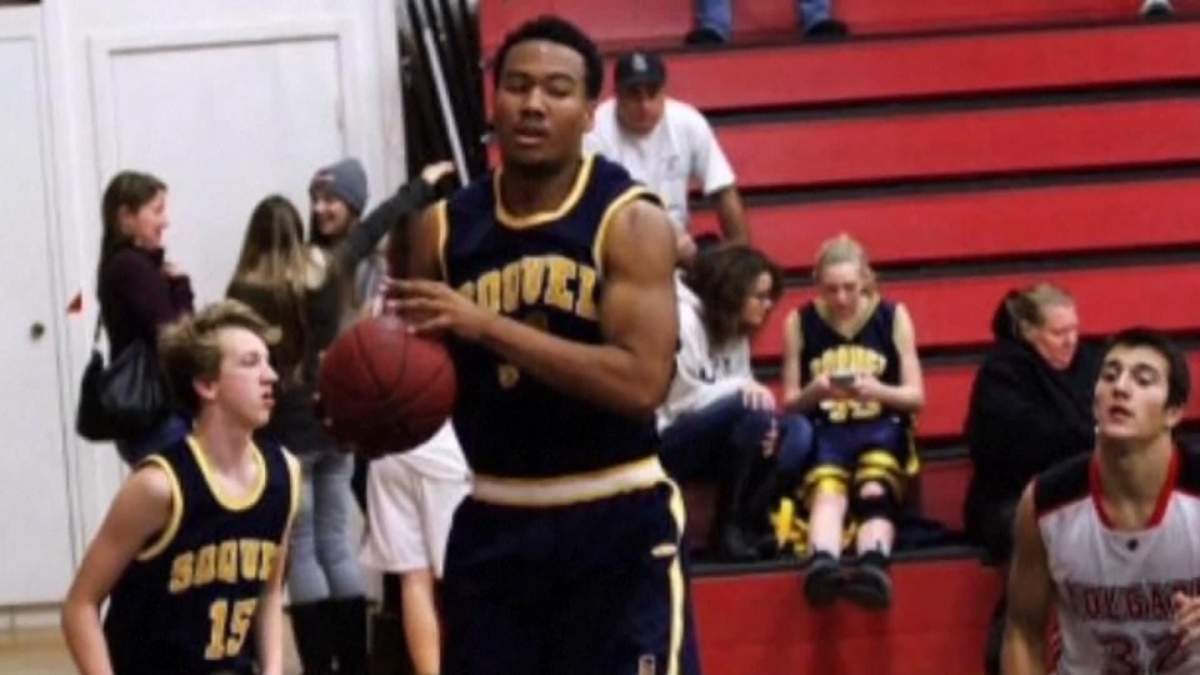 Samuel Bardwell, centre, is pictured playing basketball.