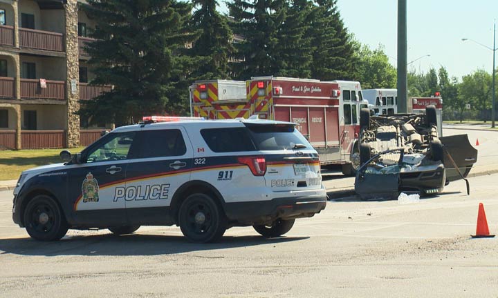 Saskatoon firefighters safely removed a woman who was trapped in an upside-down vehicle.