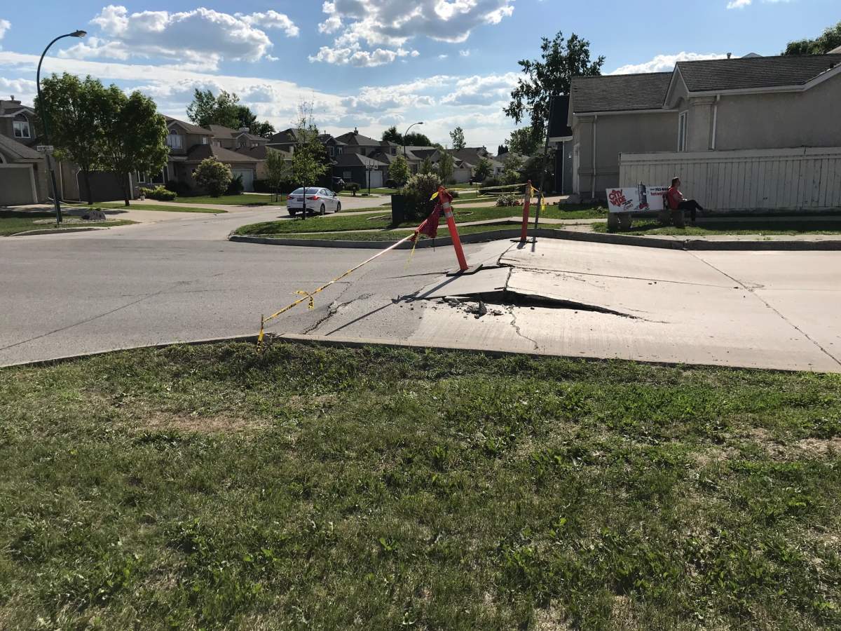 City crews are working on Scurfield Blvd. where the heat forced a section of pavement to heave then collapse.