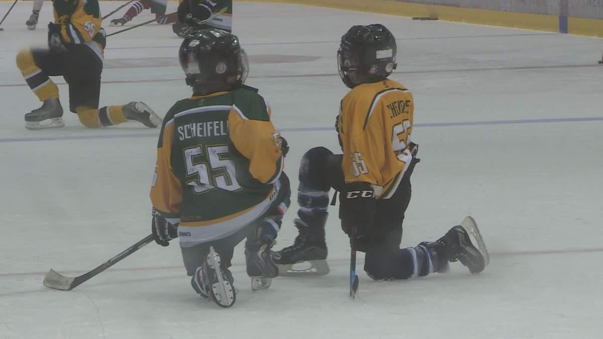 Two children wait for instructions during Mark Schiefele's 4th annual hockey camp in support of KidSport Winnipeg at Bell-MTS Iceplex. 