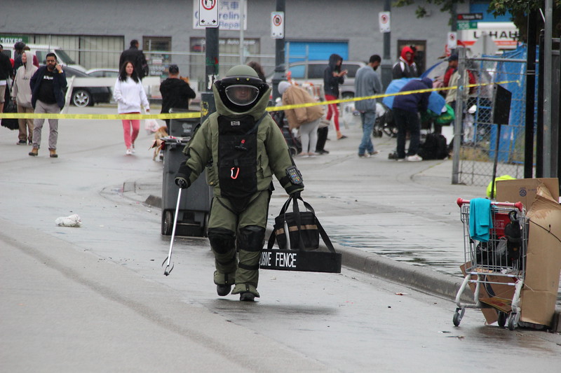 A member of the RCMP Explosives Disposal Unit on Surrey's 135A Street, Friday. 