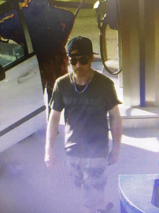 Barrie police are seeking to identify a suspect (above) in connection with a vehicle theft.