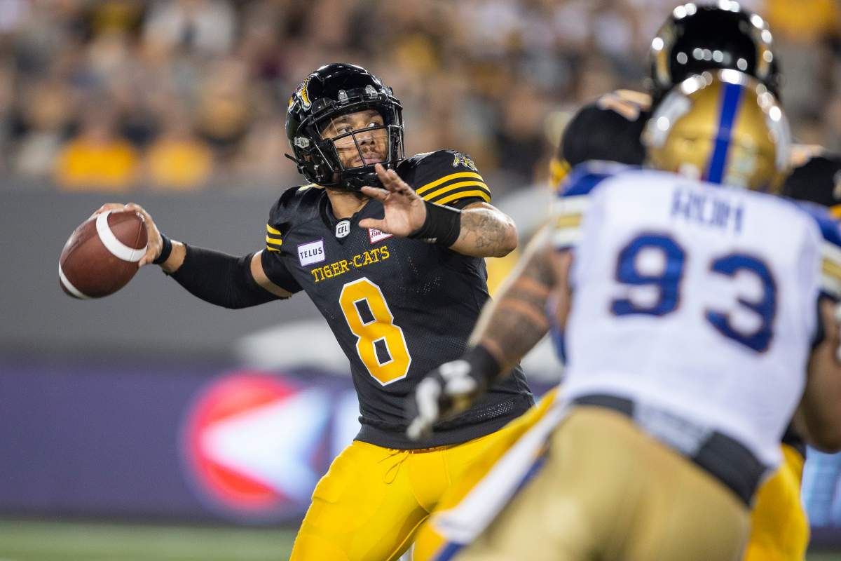 Hamilton quarterback Jeremiah Masoli looks for a receiver during fourth-quarter CFL action between the Ticats and the Winnipeg Blue Bombers in Hamilton, Ont. on Friday, June 29, 2018.