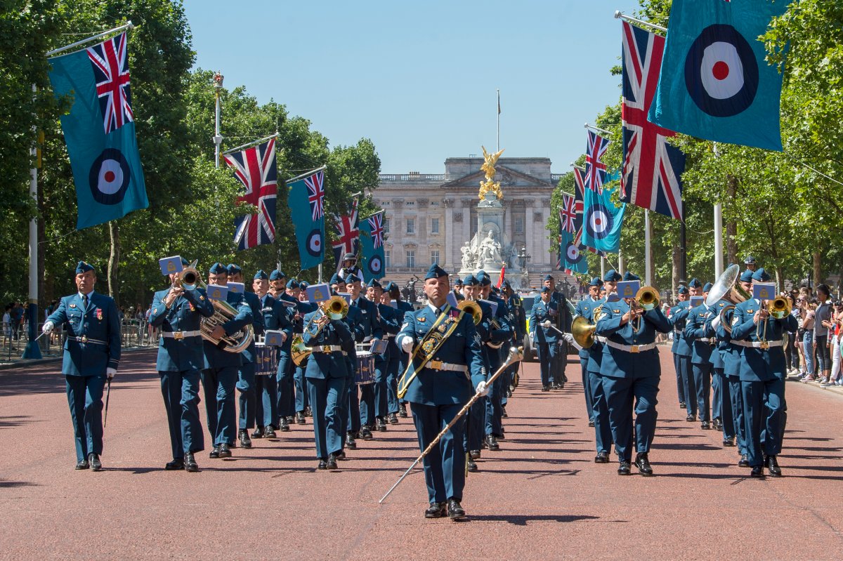 Flanked by the Union Jack and Royal Air Force flags, the Royal Canadian Air Force Band leads a portion of the RCAF Public Duties contingent down The Mall from Buckingham Palace to St. James’s Palace where the contingent will mount guard for 24 hours. 
