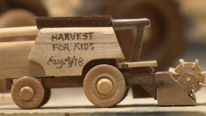 One of Reuben Andres’ miniature wooden combines.