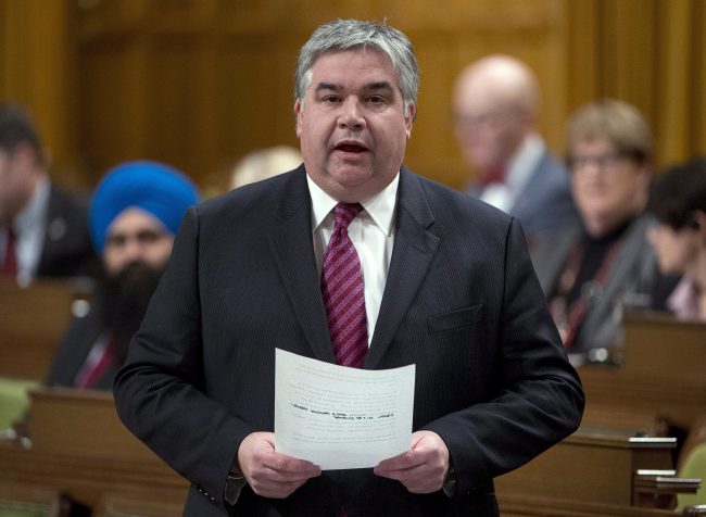 Government House Leader Peter Van Loan responds to a question during Question Period in the House of Commons Friday December 12, 2014 in Ottawa. 