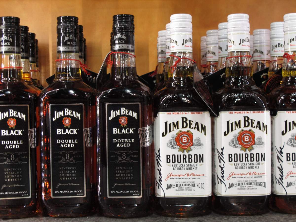 In this Jan. 13, 2014, file photo, Jim Beam bottles line the counter at the Jim Beam visitors center at Clermont, Ky.